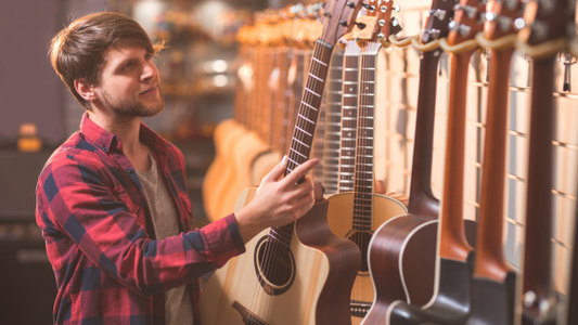 Nylon String vs Steel String Guitars - What is better for Beginners?