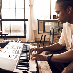 Musician playing a Casio CT-X portable arranger keyboard at home
