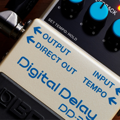 BOSS DD-3T pedal close-up on Digital Delay logo, input and output jack labels
