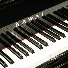 Kawai US65 upright piano keyboard close-up with Kawai logo