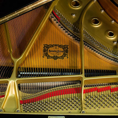 Yamaha G3A interior close-up, gold plate with ornate Yamaha Piano decal and strings