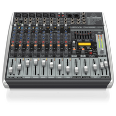 Behringer XENYX QX1222USB mixer elevated angled view, full channel strip and fader layout