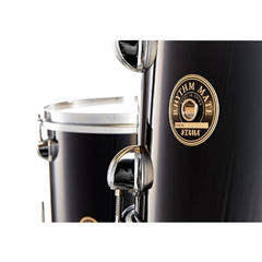Tama Rhythm Mate tom close-up, black shell with gold Made in China badge and chrome lugs