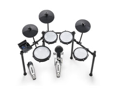 Alesis Nitro Max electronic kit high-angle view, white mesh pads and three black cymbals