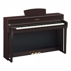 Yamaha CLP-735 Clavinova digital piano in rosewood, angled view with pedals